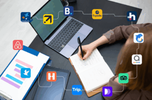 A picture of a staff working on channel manager inventory with OTA icons all around.