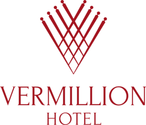Logo of Vermillon Hotel in transparent background, the word "Vermillon Hotel" all in caps lock letter in maroon colour.