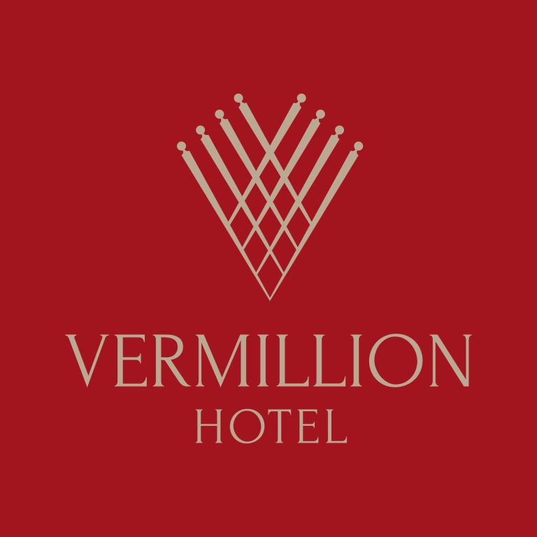 Logo of Vermillion Hotel of Iloilo City, in white colour and red background.